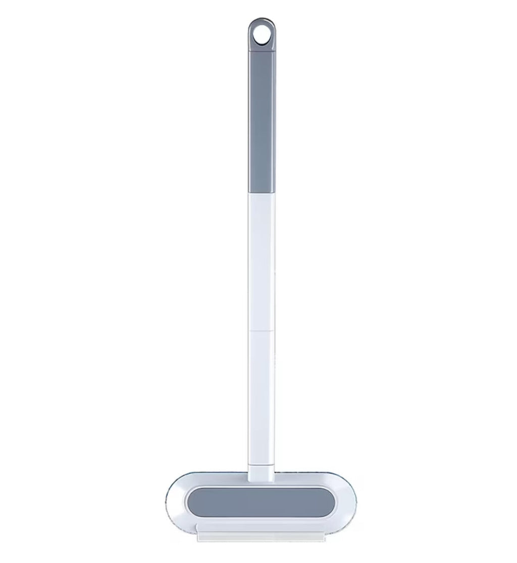Cleaning brush with a gray handle and white bristle head on a white background