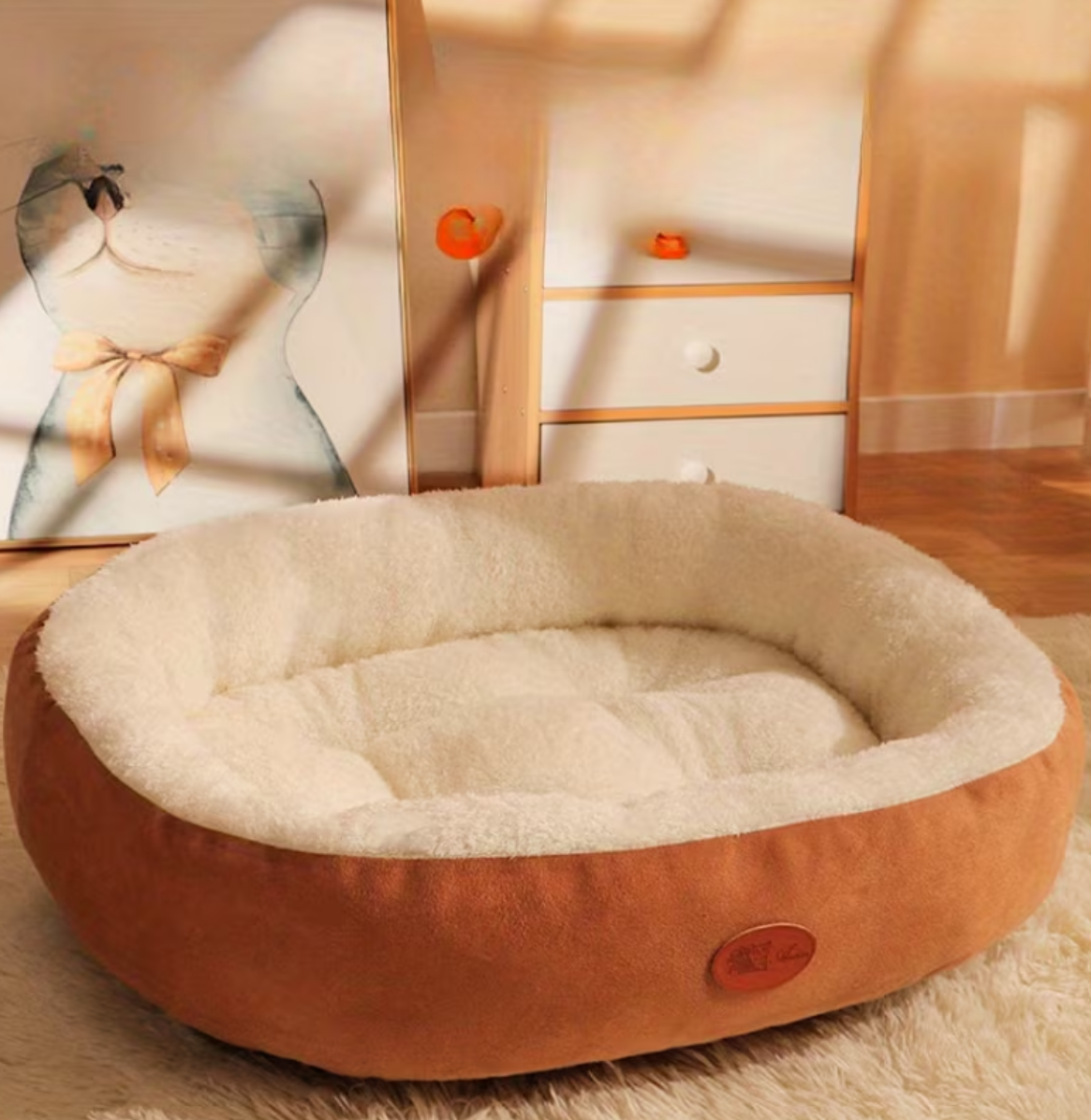 Round pet bed with brown exterior and beige interior on a wooden floor.
